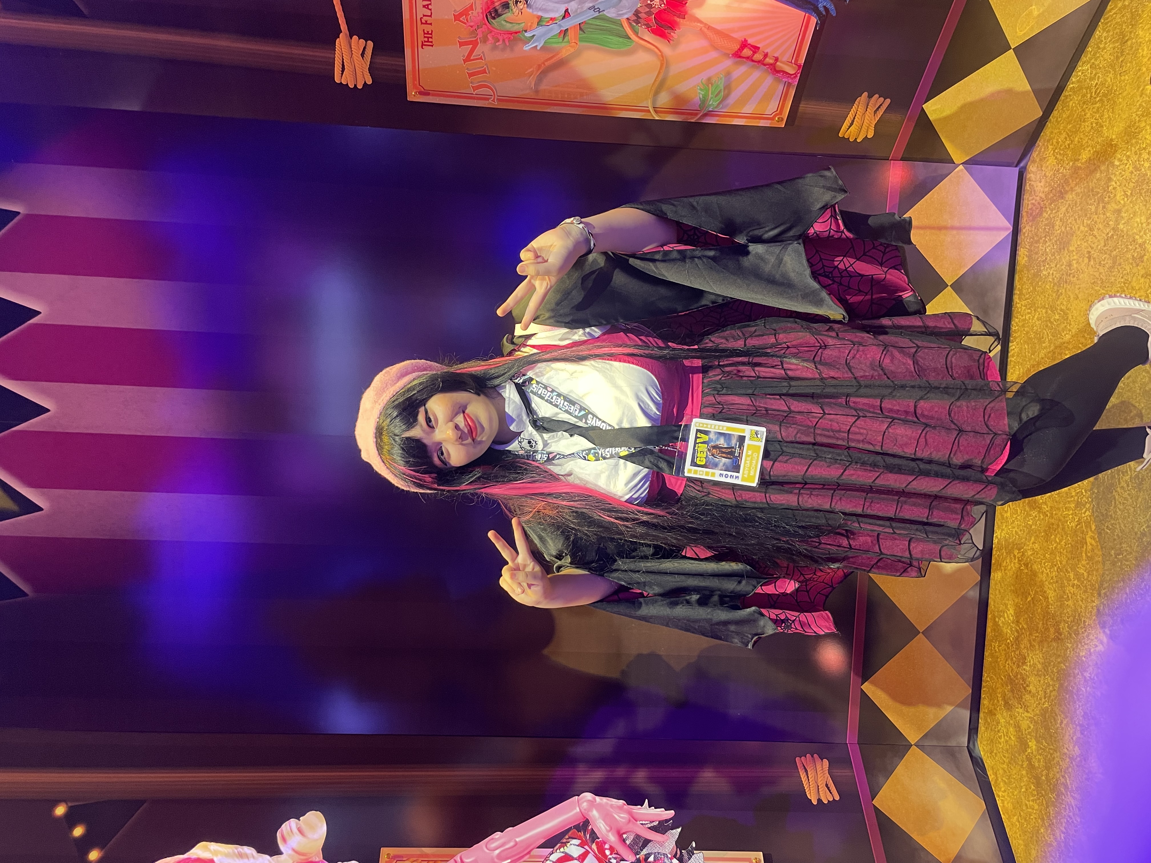 Draculara Cosplayer posing in front of decorated background
